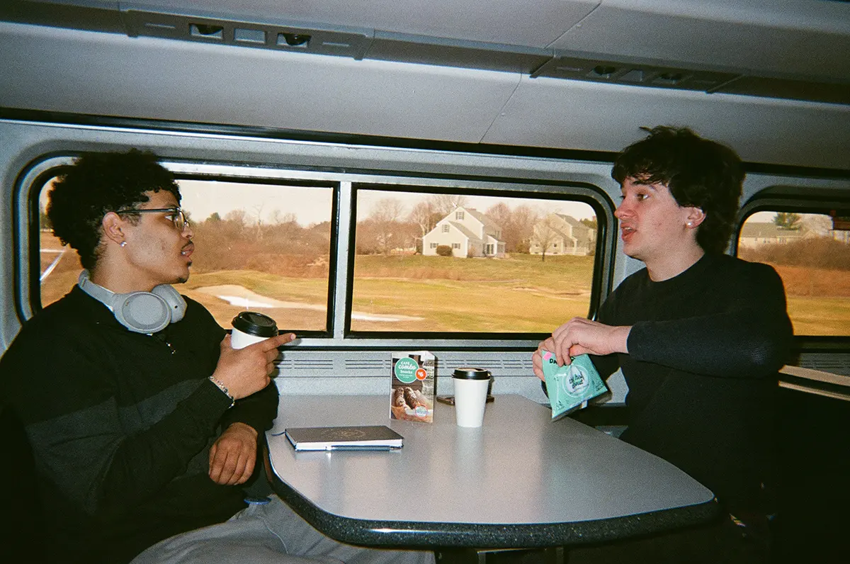 two guys in the train talking