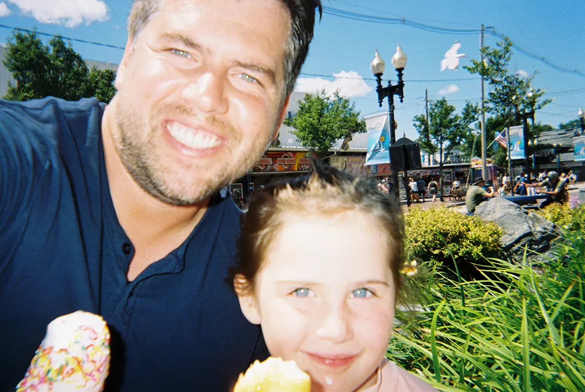 daughter and father sharing ice cream