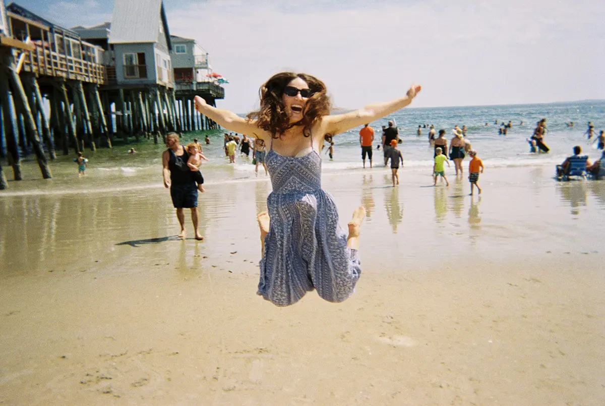 girl jumping at beach
